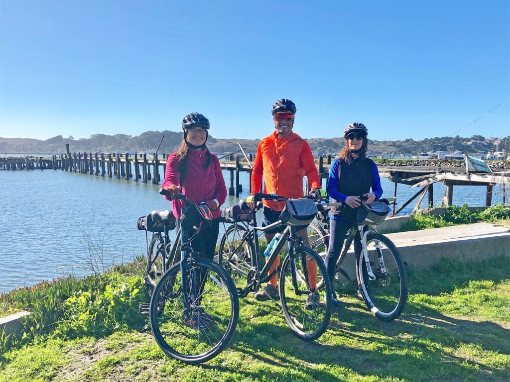 group of people biking in bodega bay