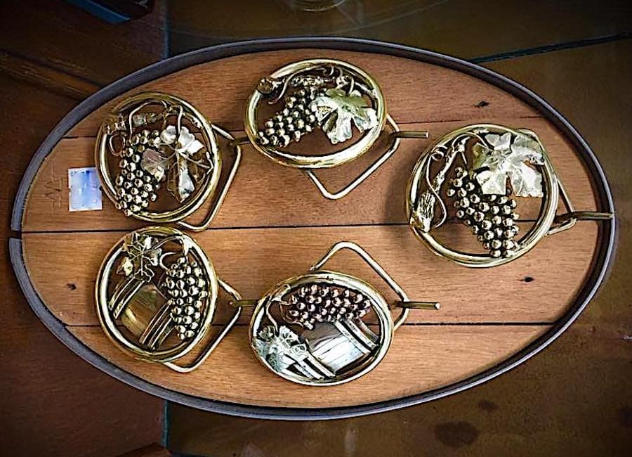 Brass belt buckles with grapevines and wine barrels from Bosworth & Son in Geyserville