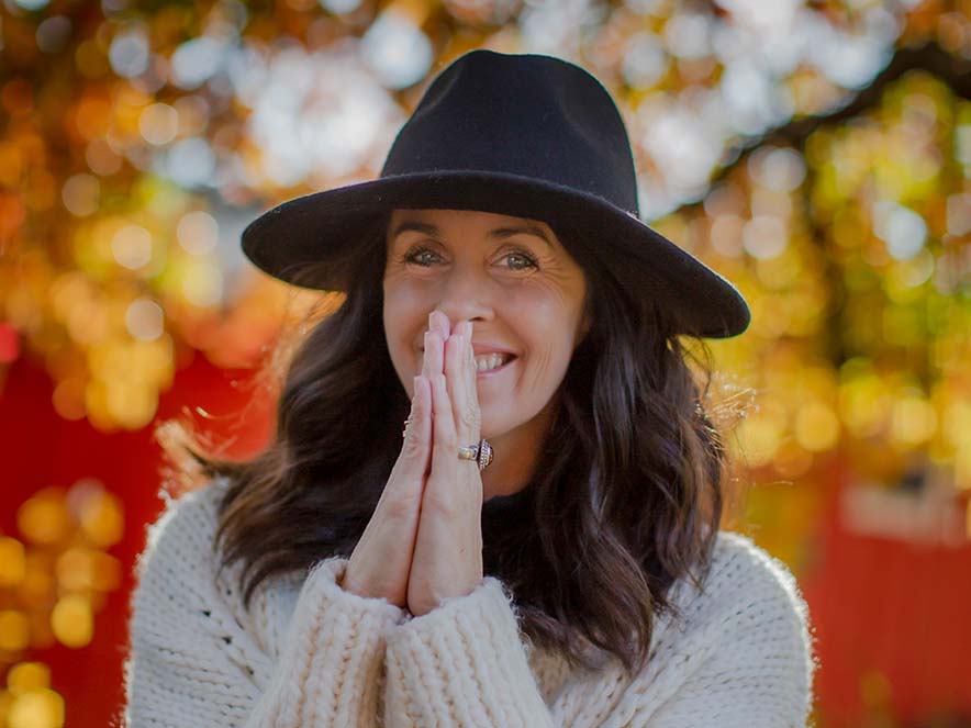 woman standing in prayer position