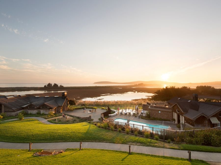 Bodega Bay Lodge exterior beside the bay at sunset 