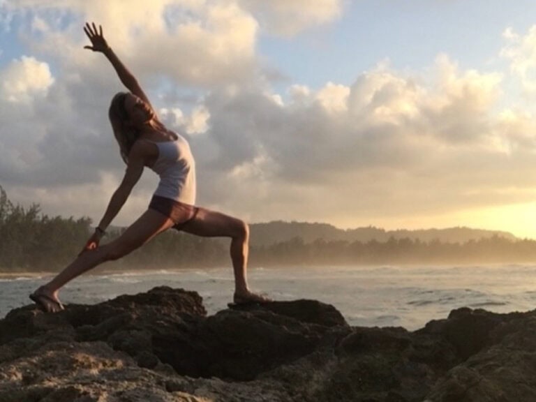 Woman practices yoga along the Sonoma County Coast.