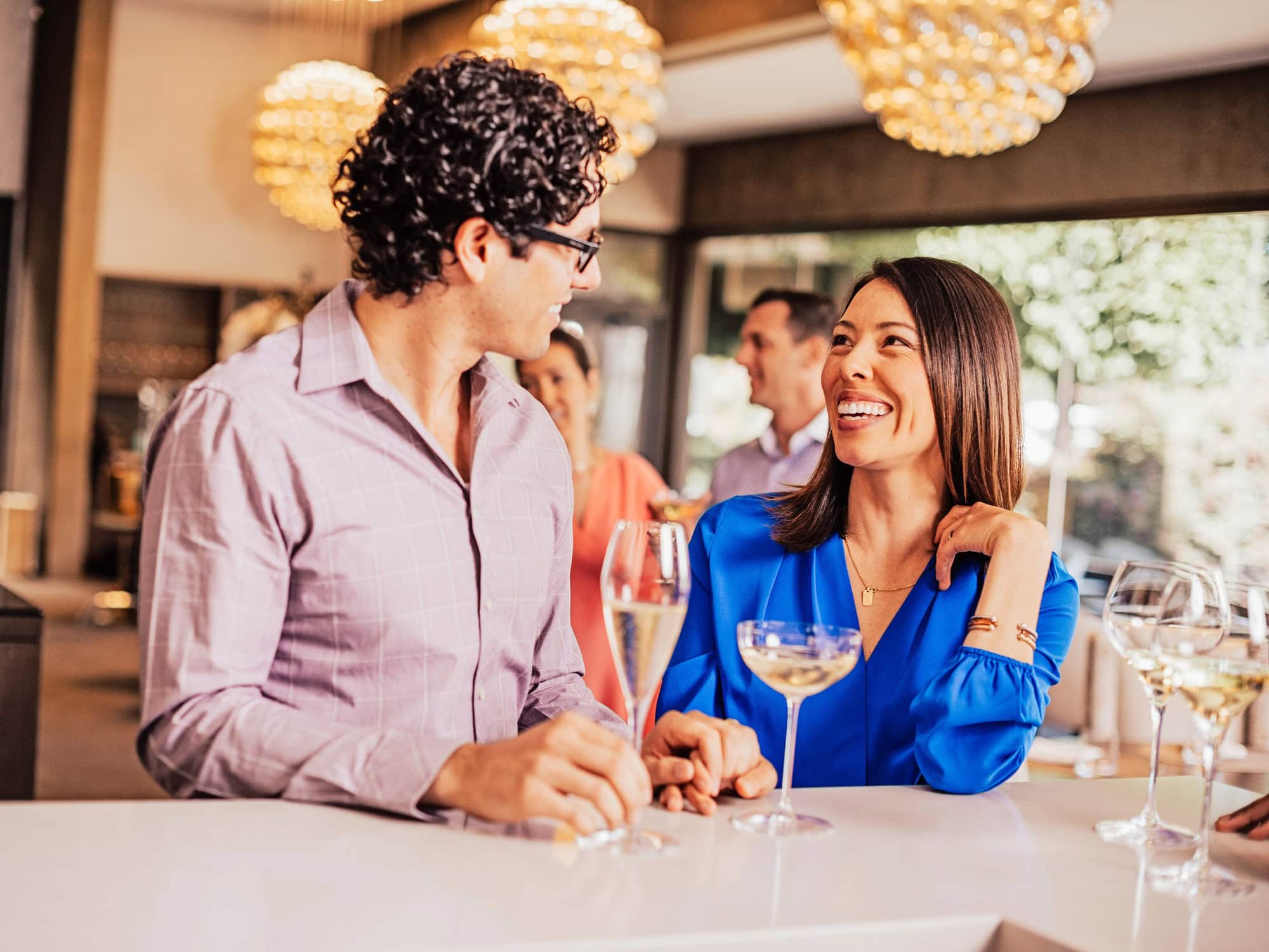 people enjoying champagne in the bubble room at j vineyards and winery in healdsburg