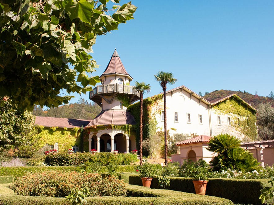 A wine castle stands with verdant trees all around, Sonoma County