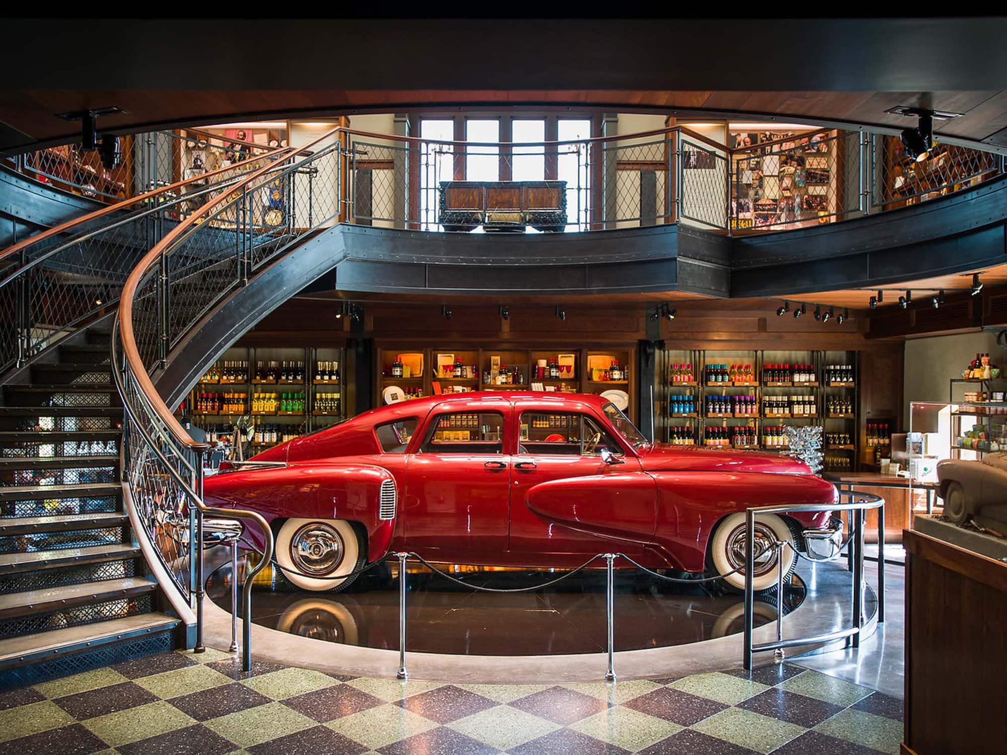 Francis Ford Coppola Winery has a red antique car on display