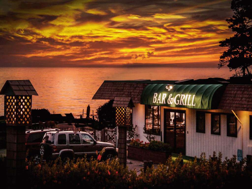 sunset on the ocean at the ocean cove lodge bar and grill in jenner