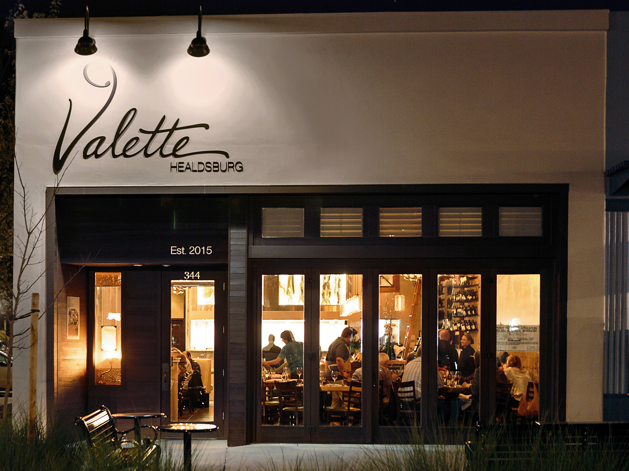 Exterior of Valette, a popular Healdsburg restaurant, at night.