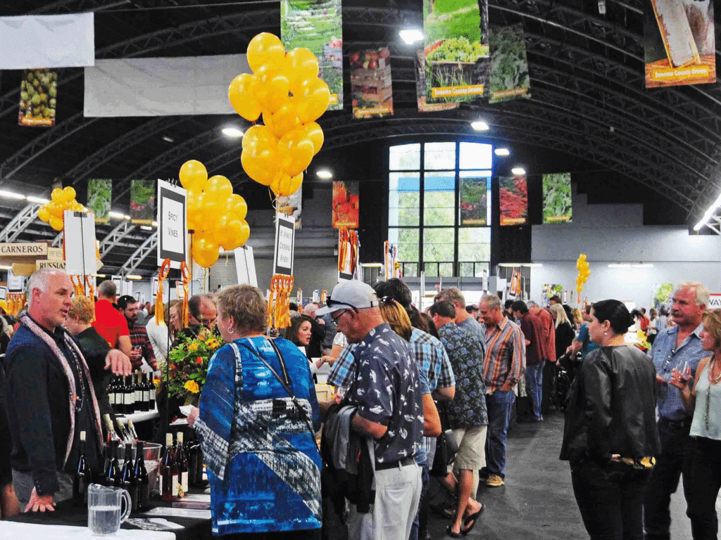 group of people at the harvest fair enjoying wine in sonoma county