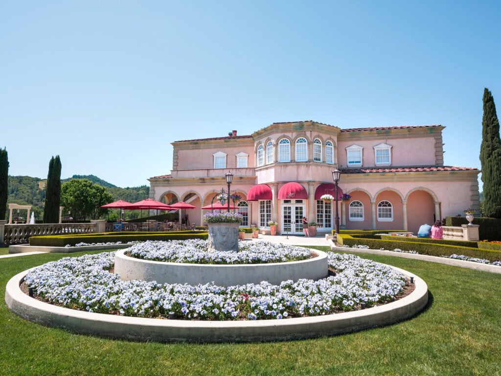 outside view of the Ferrari-Carano Vineyards and Winery with a beautiful fountain and flowers