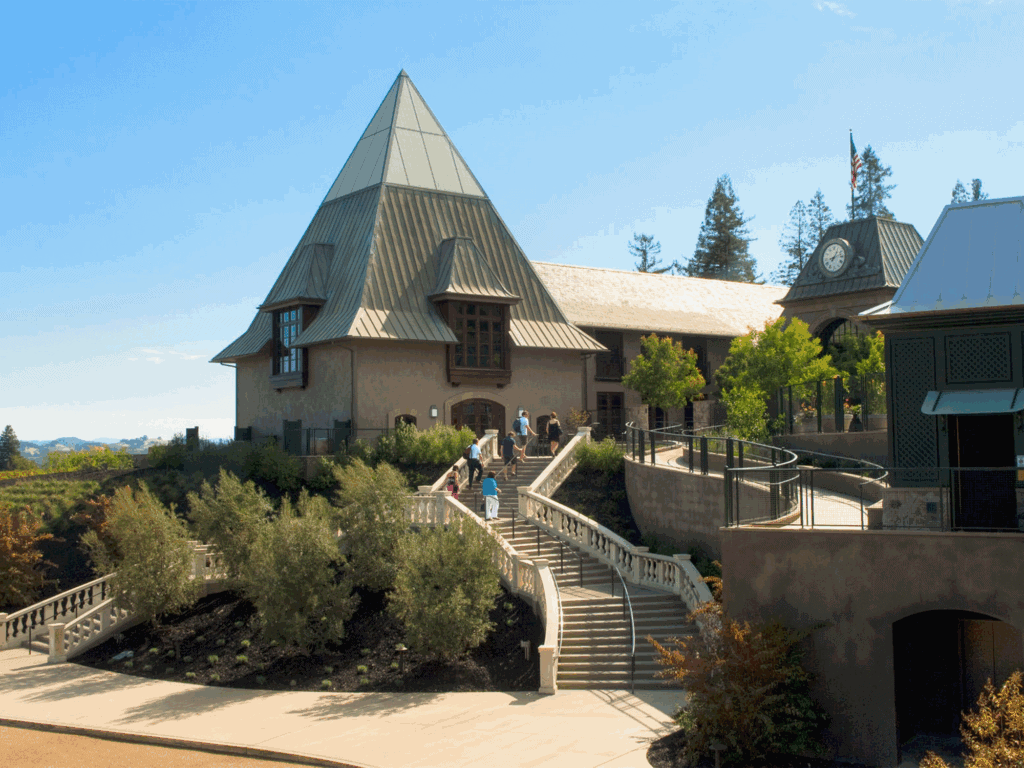 visitors walking up the staircase to enter francis ford coppola winery