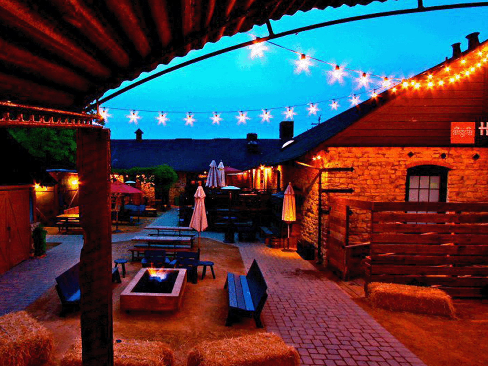 The beer garden is illuminated with lights at night at Hopmonk Tavern, Sebastopol