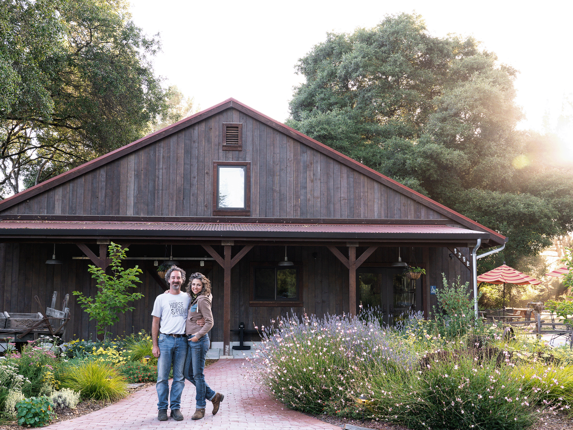 Owners Suzanne Hagins and Chris Condos stand outside of the tasting barn at Horse & Plow, Sebastopol