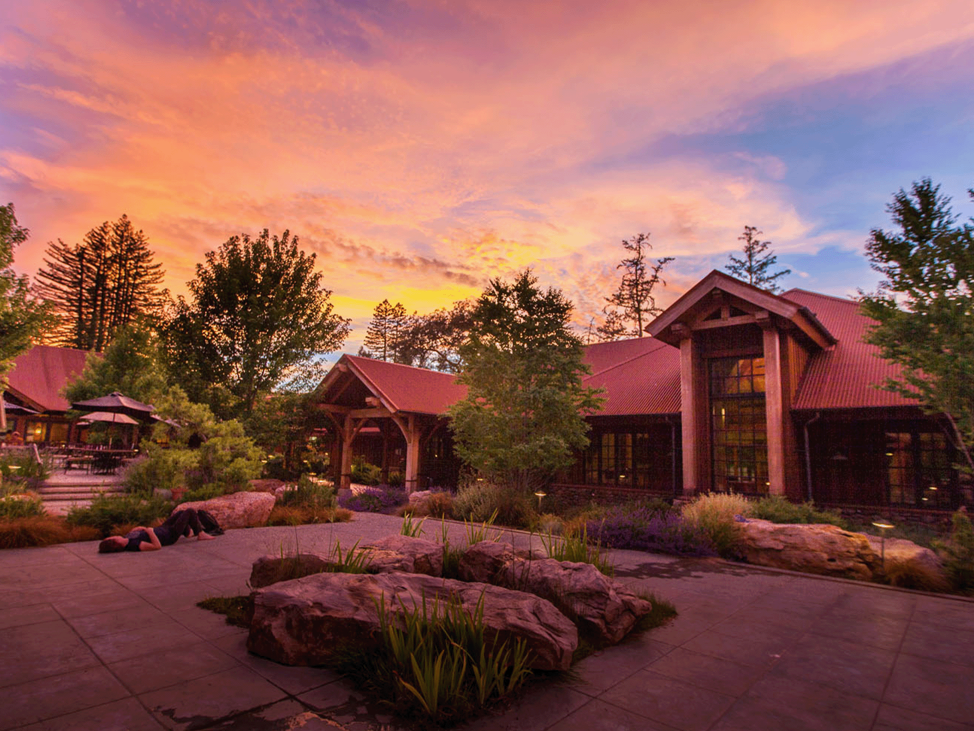 The retreat center in the setting sun surrounded by trees