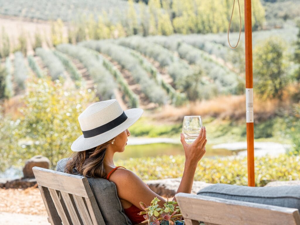 person sipping on wine at the mcevoy ranch and winery in sonoma county