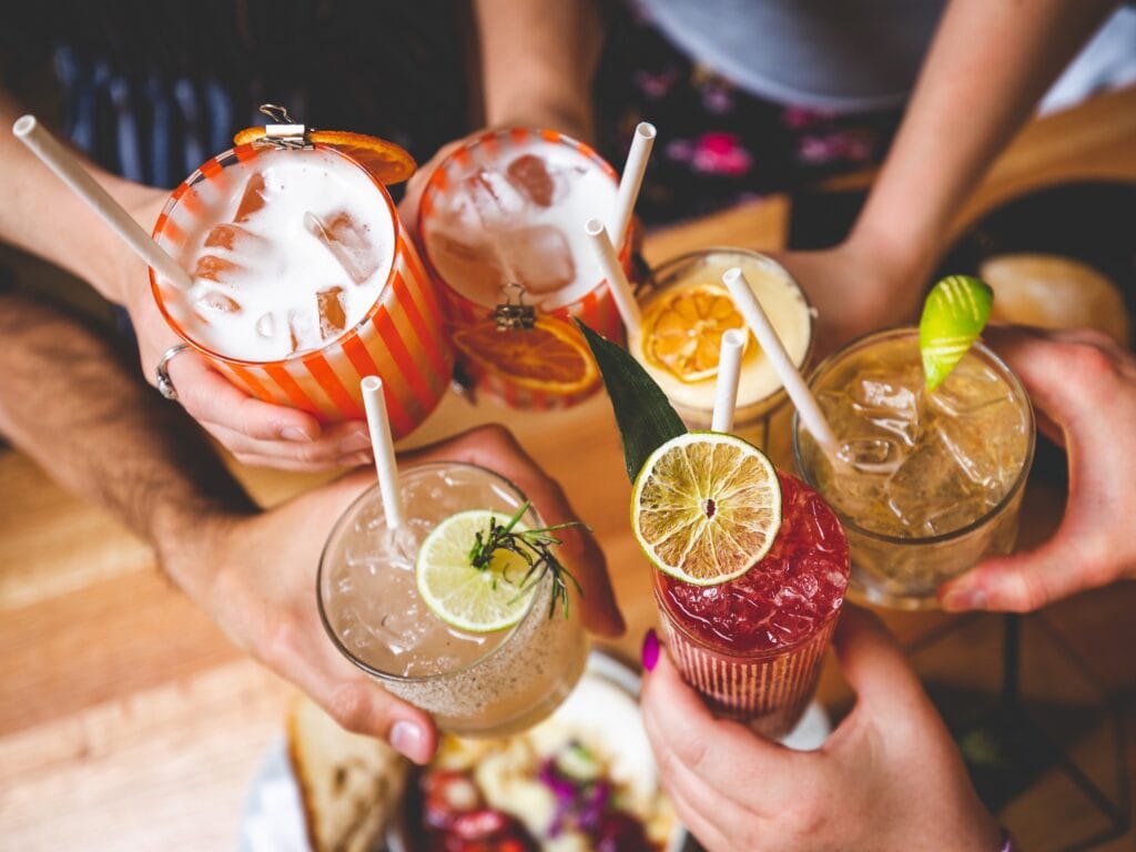 group of people cheerings craft cocktails from perch and plow in santa rosa
