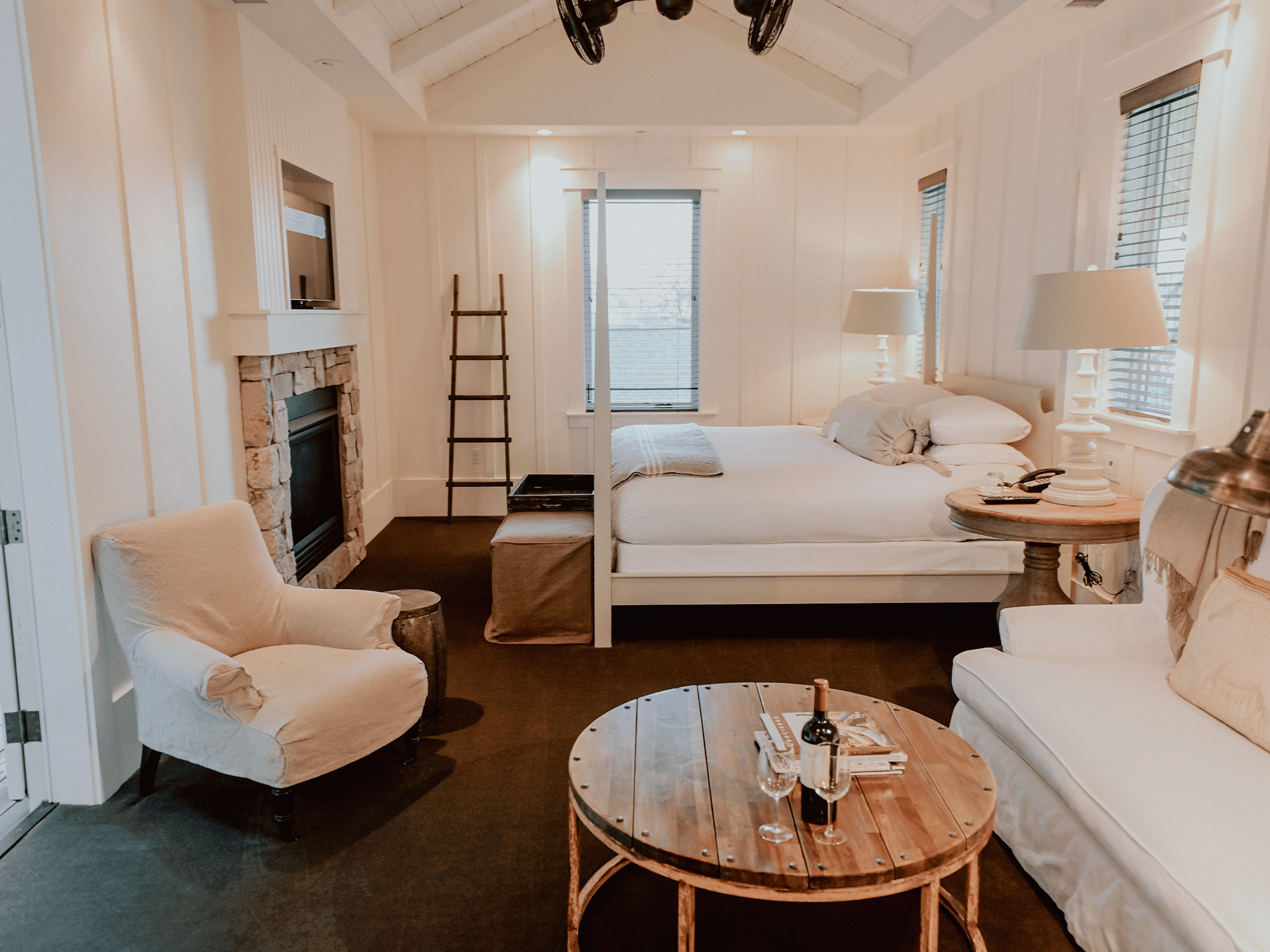 A luxurious suite with white linens
