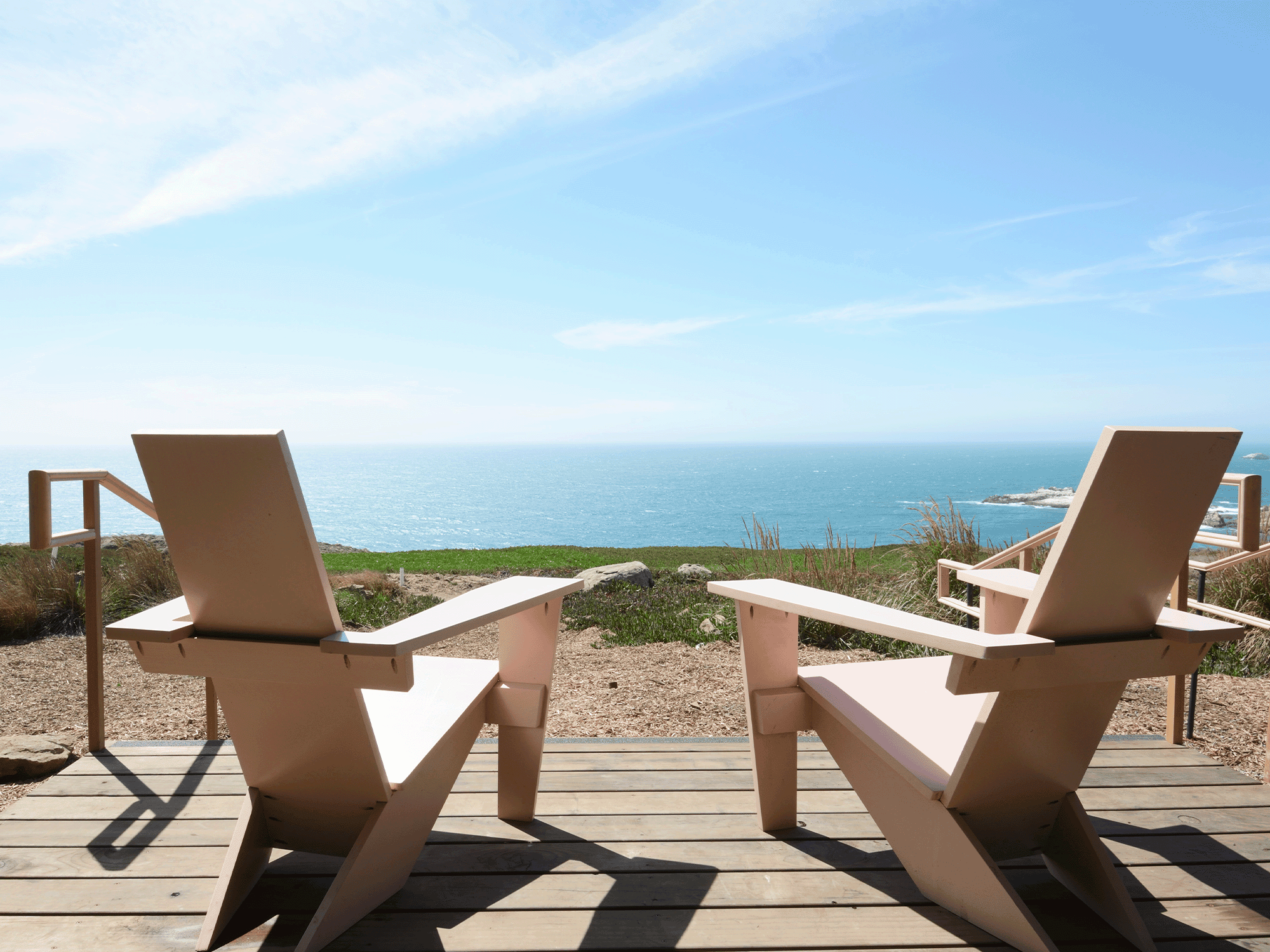 two beach chairs over looking the coast line at timber cove resort in sonoma county