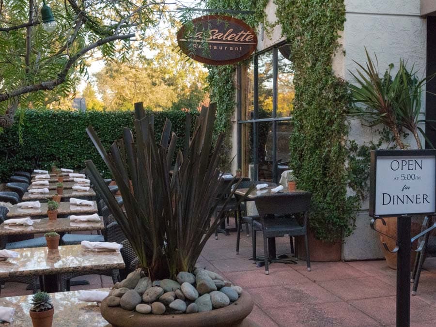 La Salette has an outdoor patio surrounded by plants