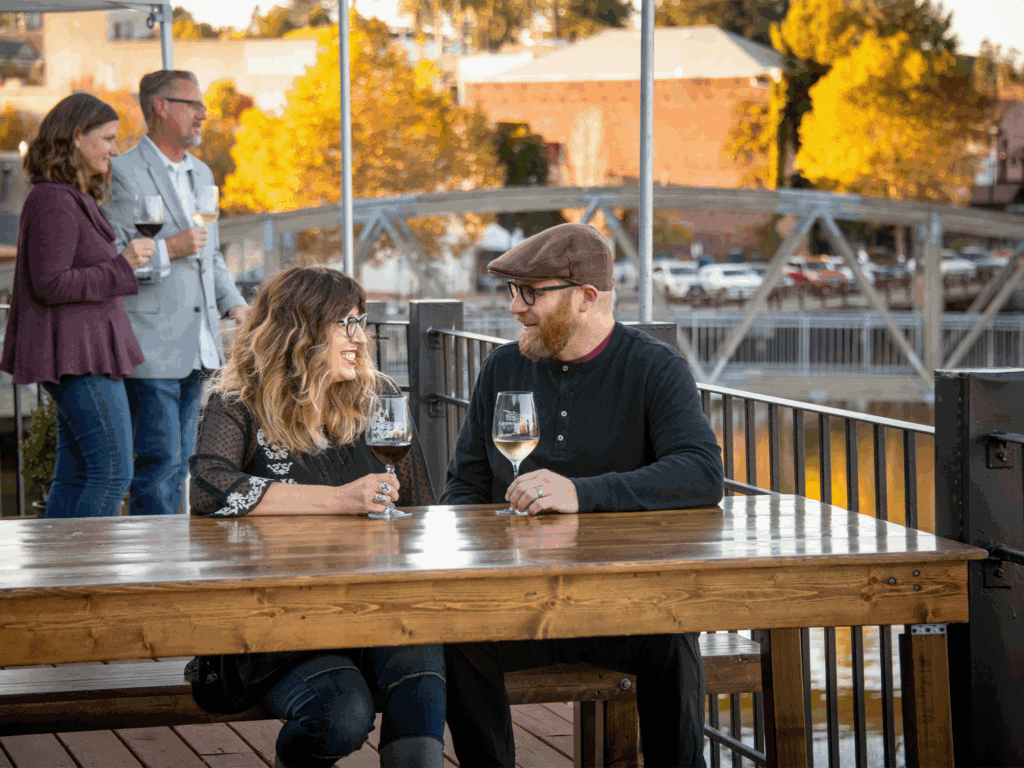 people enjoying a glass of wine at adobe road tasting room in petaluma
