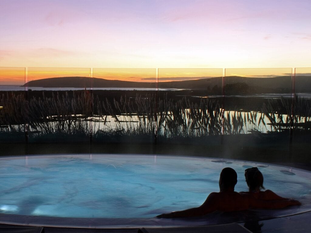 people sitting in the jacuzzi outside at the lodge at bodega bay