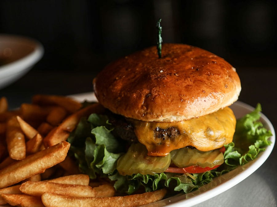 A close up photo of a burger and french fries