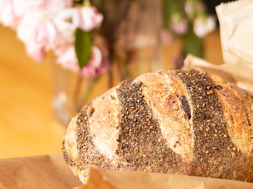 Image of fresh seeded loaf of bread at Wild Flour Bakery in Sonoma County