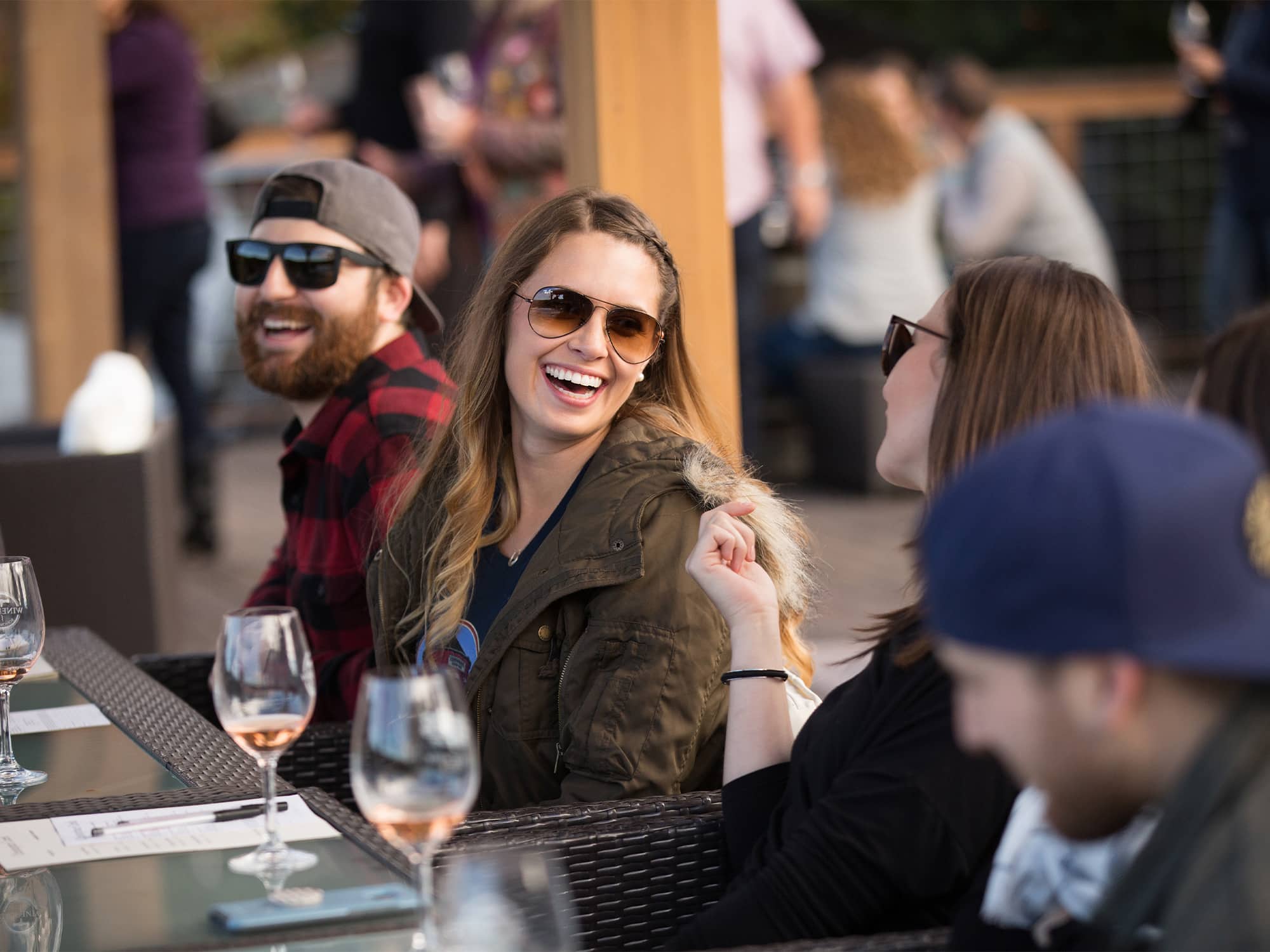 People enjoy wine around a table at the event Wine and Food Affair, Sonoma County