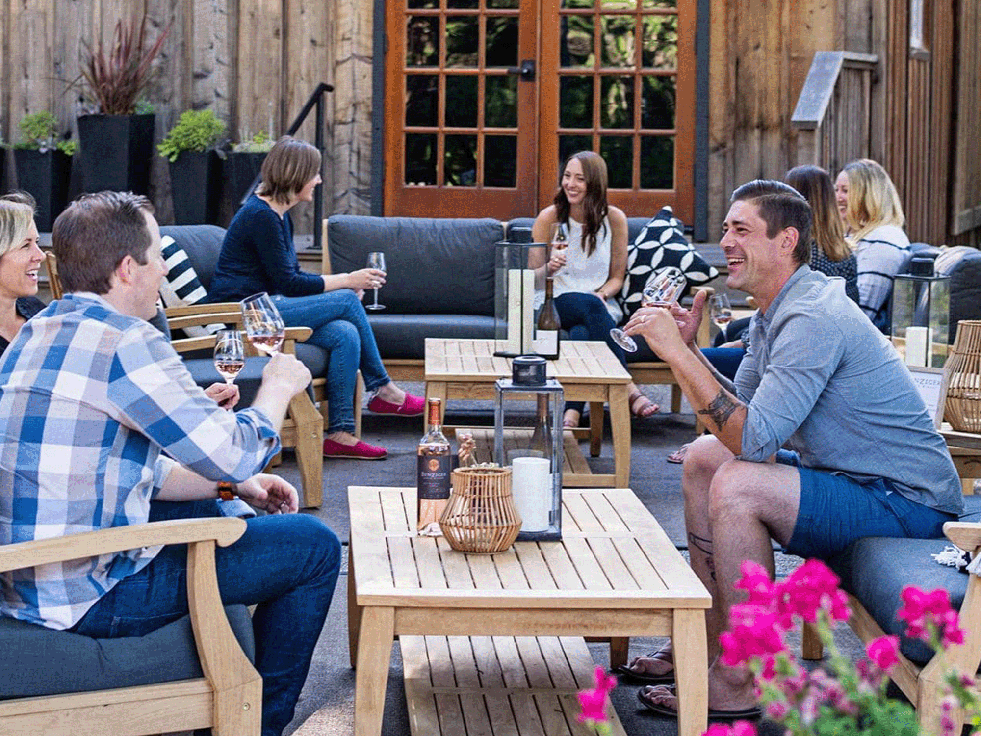 people wine tasting on the patio at benziger family winery in sonoma county