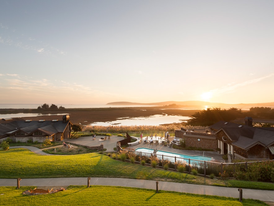 Bodega Bay Lodge shimmers in the setting sun along the coast in Sonoma County