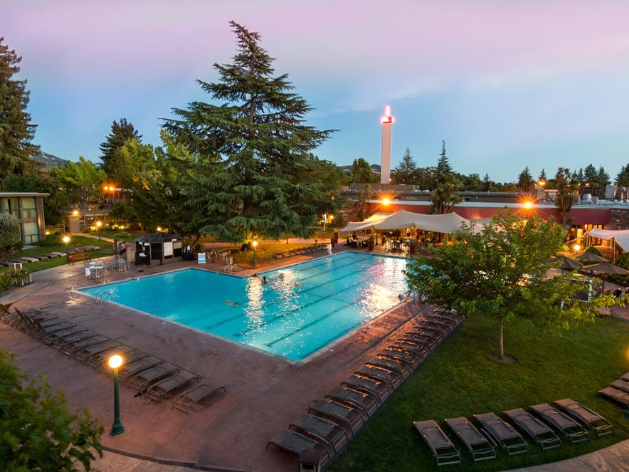 The pool from above at sunset shines in the light