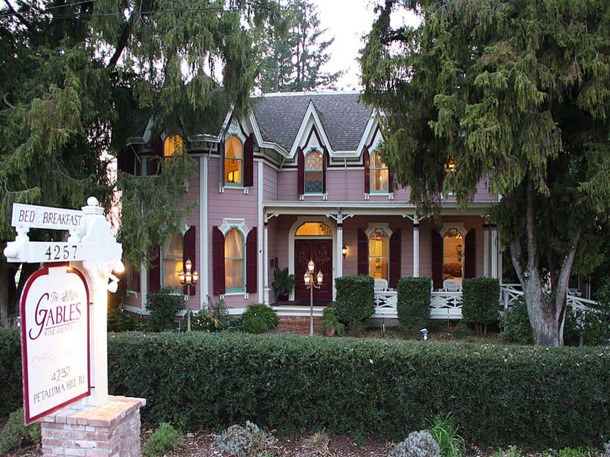 The pink, Victorian exterior of the The Gables Wine Country Inn, a Bed & Breakfast