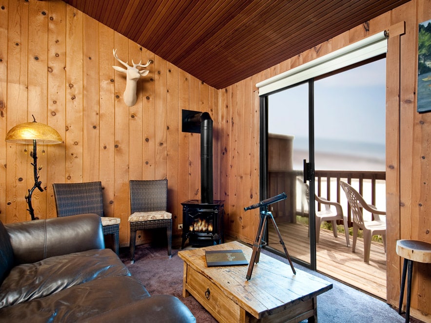 The interior of the rustic room overlooks the river at Jenner