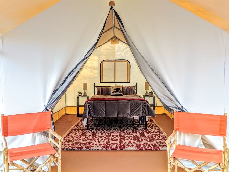 You can see the comfy bed from the outside of the glamping tent when the door is open