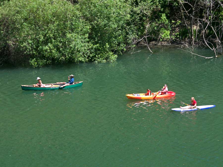 People kayaking in the waters of the Russian River in Sonoma County