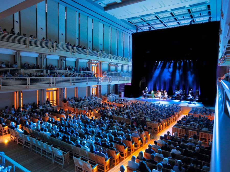 The theater is lit up with blue lights during a performance in Sonoma County