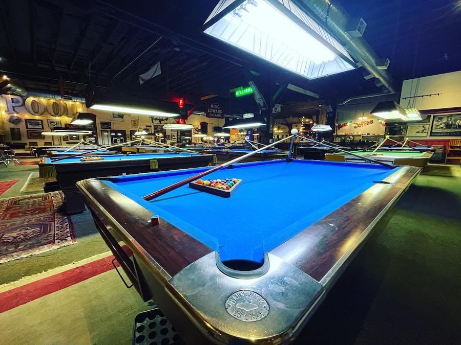 Blue-upholstered billiard tables at Buffalo Billiards in Petaluma 