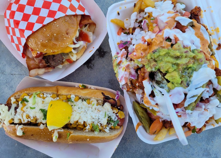 Bacon cheeseburger, dirty fries with al pastor and "corn" dog with elote at Buns Only food truck - Photo by Heather Irwin