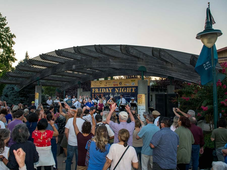 People dance in front of the band at Friday Night Live at the Plaza, Cloverdale