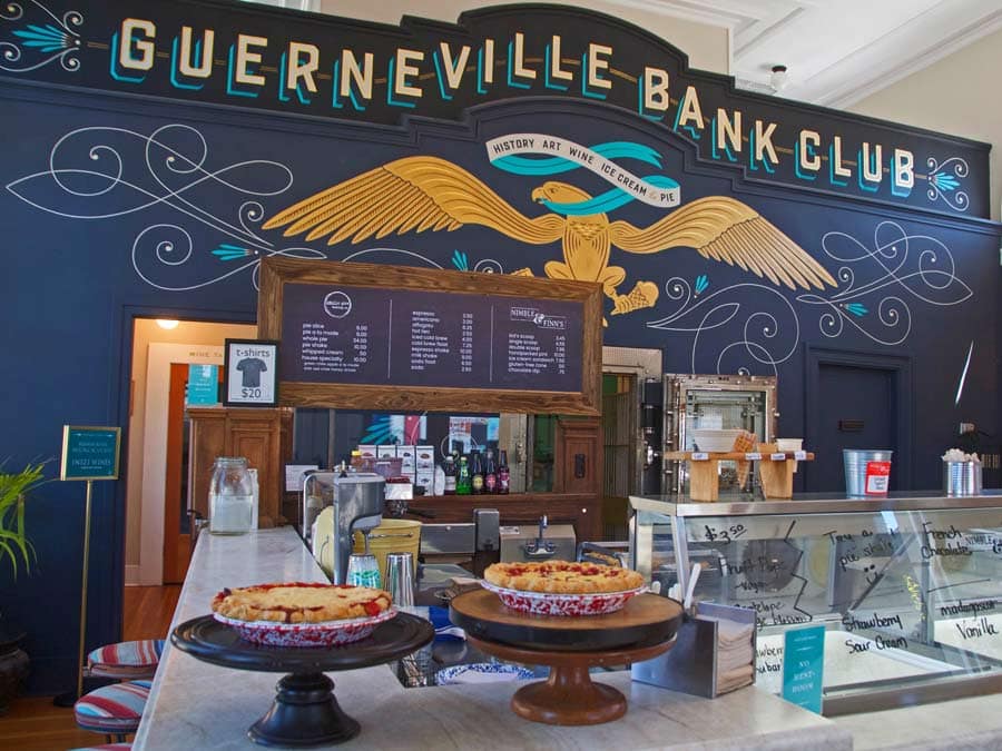 The interior of the shop has a colorful mural that says Guerneville Bank Club