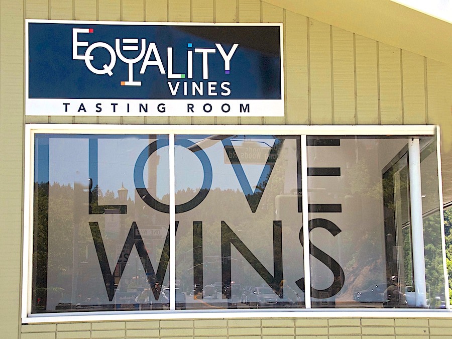 Along Main Street in Sonoma County's downtown Guerneville, the window of the Equality Vines wine tasting room bears a sign reading, "Love Wins" 