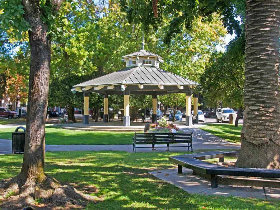 The gazebo in the plaza is surrounded by trees