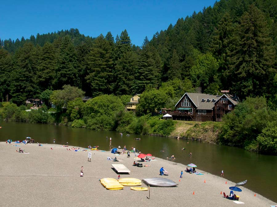 People sunbathe along the Russian River at Monte Rio Community Beach, Sonoma County