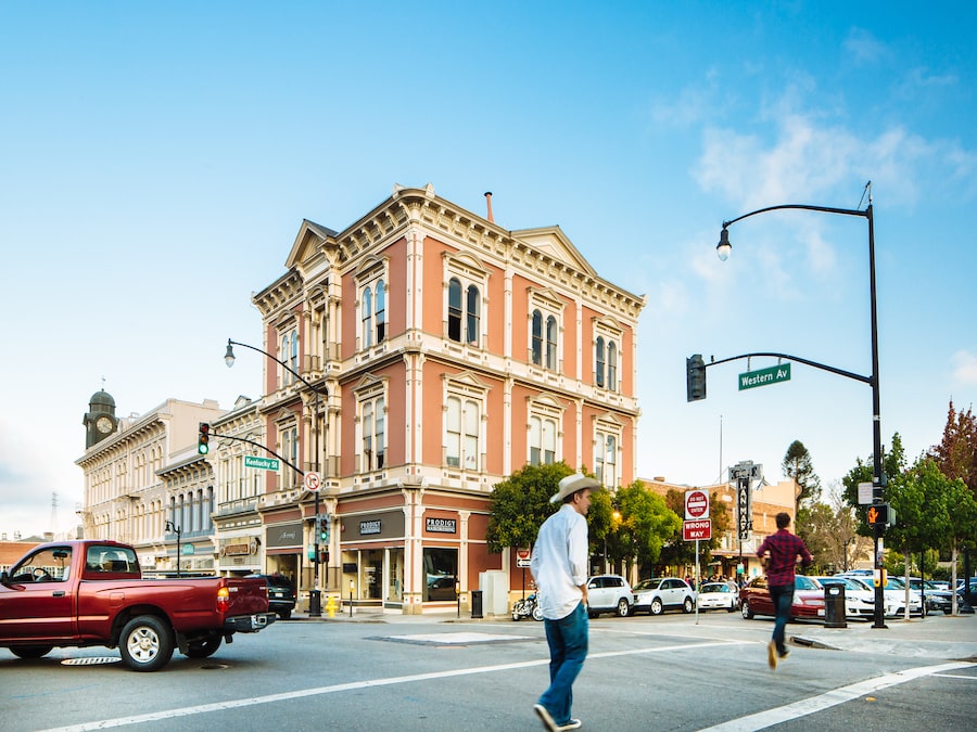 Pedestrians strolling past a busy corner in downtown Petaluma