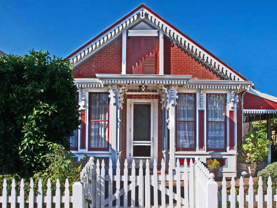 The red Victorian cottage hosts the museum