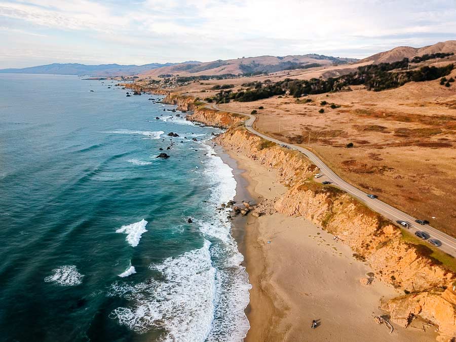 The aqua colored water hugs the pacific coastline