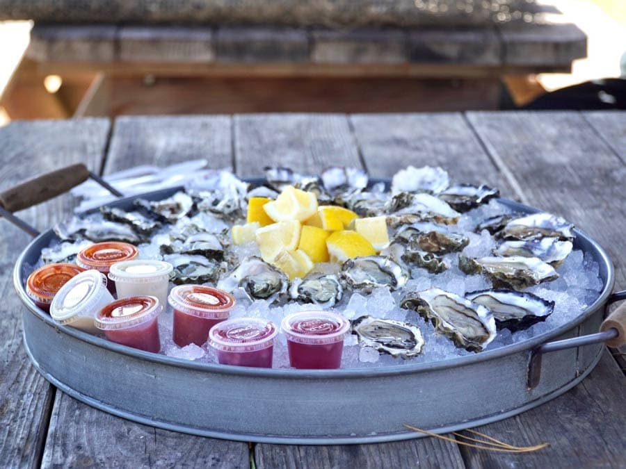 Dozens of oysters on the half shell, served on ice