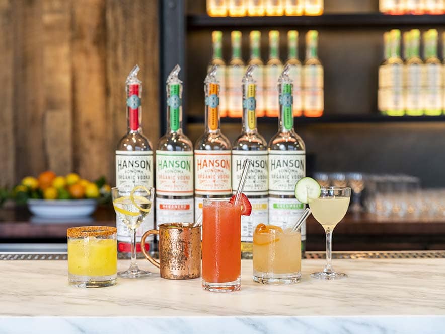 colorful bottles of flavored vodka on bar counter