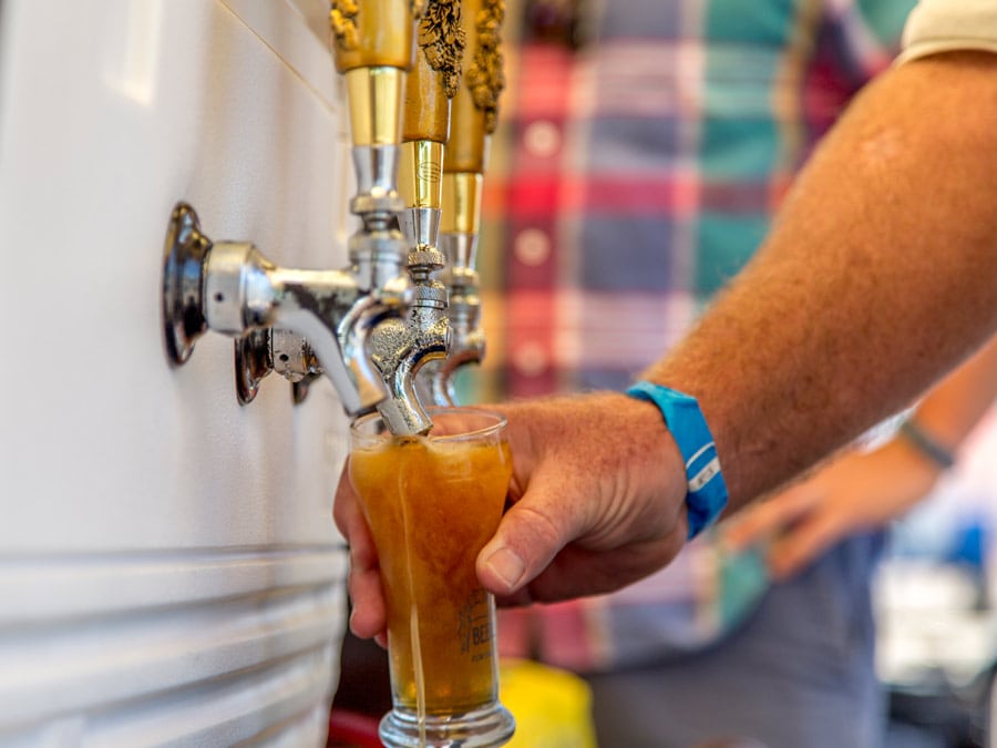 A beer is poured from a cooler