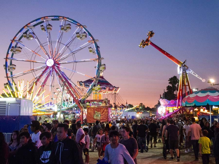 People enjoy carnival rides at dusk at the Sonoma County Fair, Santa Rosa