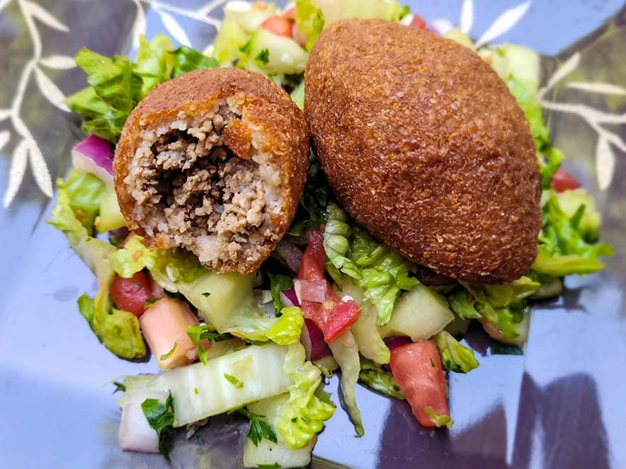 kibbeh on salad at falafel hut