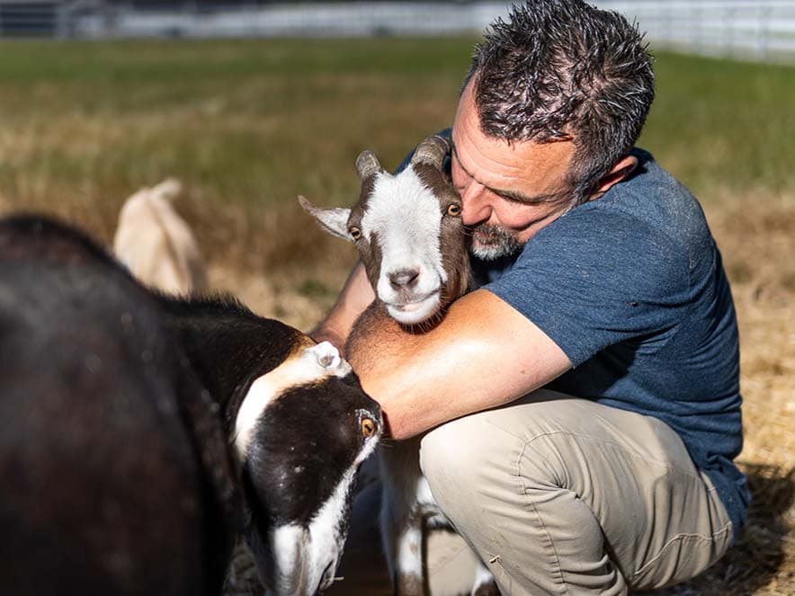 man holding goat